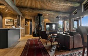 a living room with a couch and a table at Awesome Home In Hornindal With Wifi in Hornindal