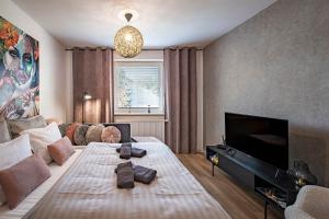 Postel nebo postele na pokoji v ubytování Apartments Centrum Hviezdoslav