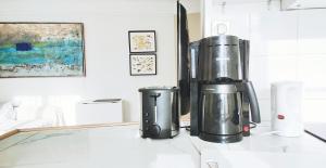 a blender sitting on top of a counter at Luxueux appartement sur jardin in Paris