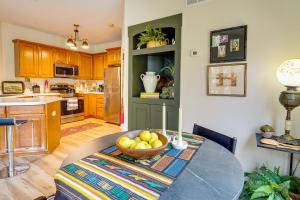 a kitchen with a table with a bowl of fruit on it at Charming Granville Home with Porch - Walk Downtown! in Granville +16 photos