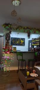 a room with a counter with christmas decorations on the wall at HOTEL DEPARTAMENTAL in Ibagué