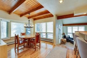 a dining room with a table and chairs at East Village Duplex at Copper Mountain Resort! in Frisco