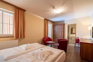 Postel nebo postele na pokoji v ubytování Hotel Alte Post