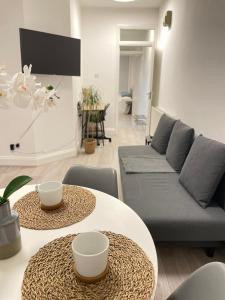 a living room with two tables and a couch at King's Cross in London