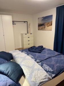 מיטה או מיטות בחדר ב-Ferienwohnung Hilda