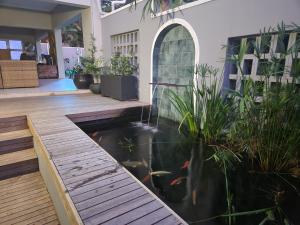 a koi pond in the middle of a house at Off Shore Ballito in Ballito