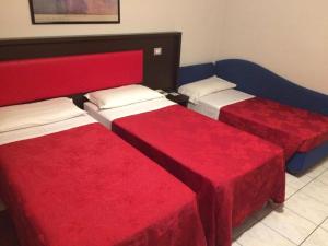 Postel nebo postele na pokoji v ubytování Hotel al Corso