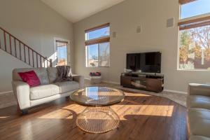 a living room with a couch and a coffee table at Paradise Retreat Heated Privat Pool BBQ in Casa Grande