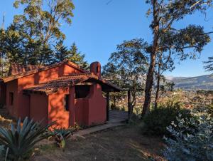 an old house in the middle of a forest at Valle Verde Lodge - Vista in Samaipata