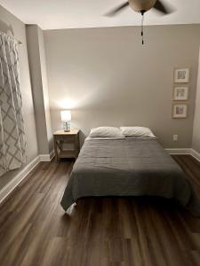 a bedroom with a bed and a ceiling fan at 2 BR 1 BA apartment in Newnan