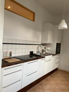 Dapur atau dapur kecil di Ferienwohnung am Neuen Garten +5 gambar