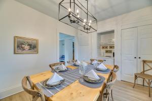 a dining room with a wooden table and chairs at Spacious Naples Vacation Rental with Private Hot Tub in Naples