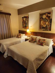 Llit o llits en una habitació de Hotel Maria