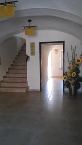 a hallway with a staircase leading to a room with a staircase leading to a at Zajazd Biskupi in Racibórz
