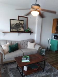 a living room with a couch and a coffee table at Cozy Getaway in Lincoln! 