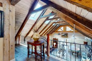 an attic room with a vase on a table at Etowah River Escape in Dahlonega