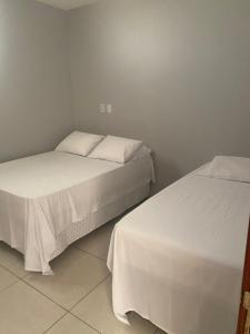 Postel nebo postele na pokoji v ubytování Mellim Residence