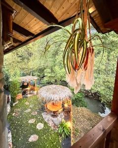 a chandelier with bananas hanging from a roof at A curuxa casa rural in El Mazo