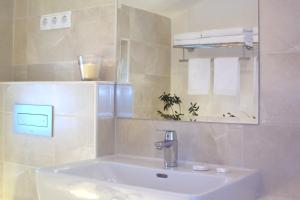 Koupelna v ubytování Refresh Boutique Apartments