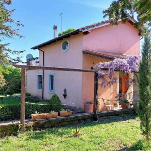 a house with potted plants in front of it at Casa di Campagna in Ronciglione