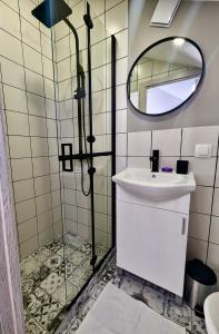a bathroom with a sink and a mirror at Lily's Studio 1 - Cozy Home - Central Sofia in Sofia