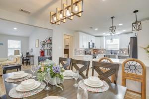 a dining room and kitchen with a table and chairs at Dog-Friendly Home in The Woodlands with Fenced Yard! in The Woodlands