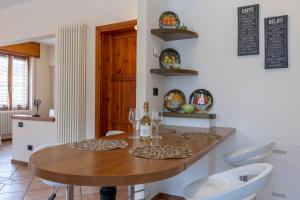 a dining room with a table and two chairs at Il Terrazzino 51 in Bellagio +9 photos