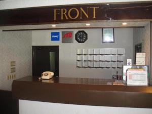 a front desk of a store with a phone at Hakuba park hotel - Vacation STAY 96005v in Hakuba
