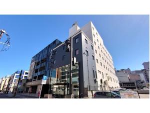 大分市にあるHotel Area One Oita - Vacation STAY 99744vの通り沿いにある高い建物