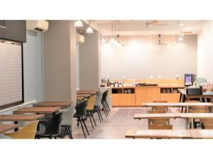 a classroom with tables and chairs and a cafeteria at Hotel Area One Oita - Vacation STAY 99740v in Oita