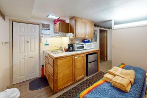 a small kitchen with a sink and a microwave at 60073 Wallowa Lake Hwy (lower unit) in Joseph