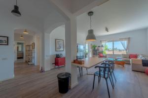 a kitchen and living room with a table and chairs at unique flat_ garden and lagoon in Hurghada