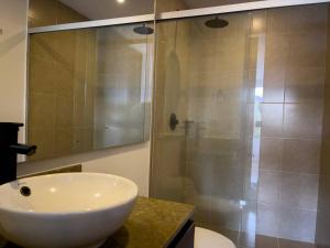 a bathroom with a white sink and a shower at Luxury, 2 Bdr, Pv Balconie, Top View El Poblado in Medellín