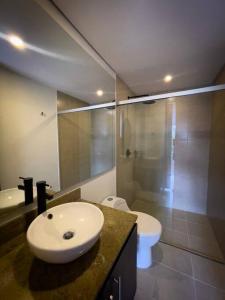 a bathroom with a sink and a shower and a toilet at Luxury, 2 Bdr, Pv Balconie, Top View El Poblado in Medellín