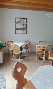 a room with wooden tables and chairs in a room at Corte Baccoi in Rovere Veronese