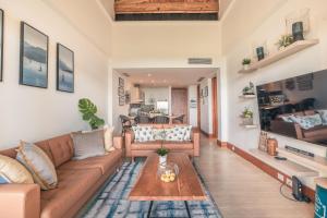 a living room with a couch and a table at Wonderful Apt at Casa de Campo in El Infiernito