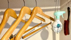 a group of wooden utensils hanging on a wall at Hotel Sunroute Patio Goshogawara - Vacation STAY 30369v in Goshogawara