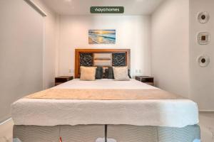 a bedroom with a large bed in a room at Amazing 1BR w/Rooftop Pool in Puerto Vallarta