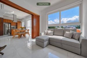 a living room with a couch and a table at Amazing 1BR w/Rooftop Pool in Puerto Vallarta