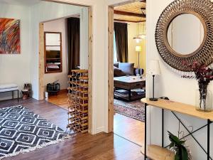 a living room with a large mirror on the wall at Holiday home Grängesberg in Grängesberg