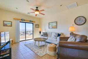 a living room with a couch and a table at Bright Cottage with Pool and Spa - 5 Mi to Lake Havasu in Lake Havasu City