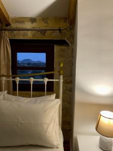 Ένα ή περισσότερα κρεβάτια σε δωμάτιο στο Windy Inns ( Maistros I )