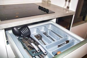 a drawer in a kitchen with utensils in it at AP- Luxury Apt nxt to o2 Academy in Birmingham