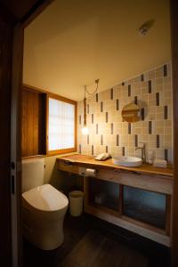 a bathroom with a toilet and a sink at Kusakimomotose - Vacation STAY 15482 in Yuzawa