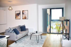 a living room with a couch and a table at AP- Luxury Apt nxt to o2 Academy in Birmingham