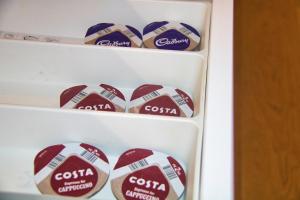 a refrigerator filled with lots of coca cola cookies at AP- Luxury Apt nxt to o2 Academy in Birmingham