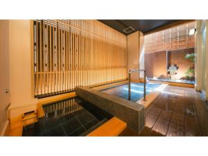 a pool of water in the middle of a room at Old England Dogo Yamanote Hotel - Vacation STAY 75541v in Matsuyama
