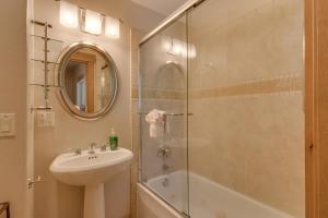 a bathroom with a sink and a glass shower at High Sierra at Dollar Point - Private Hot Tub, Close to Ski Resorts, Pet Friendly! in Tahoe City +14 photos
