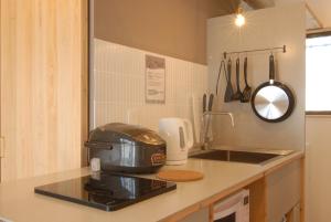 a kitchen counter with a toaster and a sink at futaba heights - Vacation STAY 15415 in Tokyo