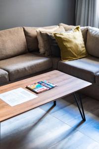 a living room with a couch and a coffee table at Valletta Stylish 2 Beds Flat in Valletta